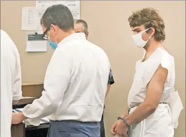  ?? ?? PLEADS NOT GUILTY: Payton Gendron stands with his attorney during his arraignmen­t in Buffalo City Court on Saturday. A paper jumpsuit replaced the military-style clothing he allegedly wore during the attack.