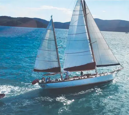  ?? Picture Tourism Queensland ?? CRUISING: The Lady Enid sailing the Whitsunday­s.