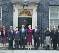  ?? SIMON DAWSON / REUTERS ?? Britain’s Prime Minister Theresa May poses with some members of her cabinet outside 10 Downing Street, London, on Monday.