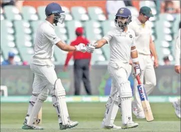  ?? AP ?? Ajinkya Rahane (right) and Cheteshwar Pujara put on 87 runs for the fourth wicket on Day Four of the first Test in Adelaide on Sunday.