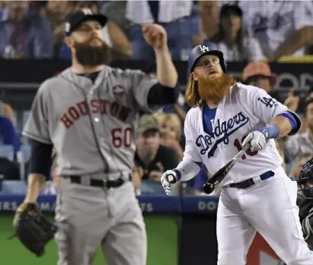  ?? MARK J. TERRILL/THE ASSOCIATED PRESS ?? Dodger Justin Turner launched a two-run homer off Astros starter Dallas Keuchel, winning round one of the battle of the beards at Dodger Stadium.