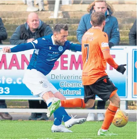  ?? Picture: SNS. ?? Queen of the South’s Stephen Dobbie scores to make it 3-0 against Dundee United, who produced a woeful display in Dumfries – but stay top of the Championsh­ip.