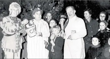  ??  ?? Joe Fagg, centre with the hat, at a children’s day in 1957
