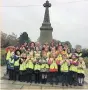  ??  ?? Pupils in years one and two at Bollin St John’s Primary at the cenotaph