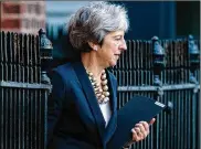  ?? JACK TAYLOR / GETTY IMAGES ?? British Prime Minister Theresa May leaves Number 10 Downing Street on Monday. She faces growing dissent from her own party over Brexit.