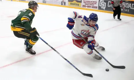  ?? CITIZEN PHOTO BY JAMES DOYLE ?? Nick Poisson of the Prince George Spruce Kings works against Neil Samanski of the Powell River Kings deep in the Powell River zone during Thursday night’s BCHL game at Rolling Mix Concrete Arena.