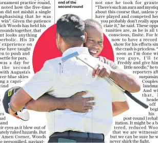  ?? ?? Job done: Tiger Woods hugs playing partner Jason Day at the end of the second round