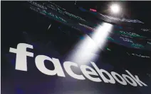  ?? Associated Press photo ?? In this 2018 file photo, the logo for Facebook appears on screens at the Nasdaq MarketSite in New York’s Times Square.