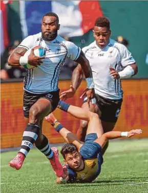  ?? EPA PIC ?? Fiji’s Semi Radradra (left) breaks away from Lautaro Bazan Velez (second left) of Argentina during their World Cup Sevens match on Saturday.