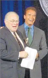  ?? Rich Pedroncell­i Associated Press ?? REVERED INTELLECTU­AL Starr, left, and Gov. Arnold Schwarzene­gger smile after unveiling the design for the California state quarter at a ceremony in Sacramento in 2004.