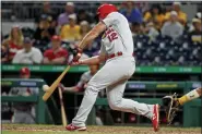  ?? GENE J. PUSKAR — THE ASSOCIATED PRESS ?? St. Louis Cardinals’ Paul DeJong hits a solo home run off Pittsburgh Pirates relief pitcher Jose Osuna during the eighth inning of a baseball game in Pittsburgh, Wednesday. It was DeJong’s third home run of the game.