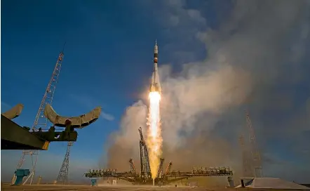  ?? GETTY ?? A Soyuz booster rocket launches a spacecraft from Kazakhstan’s Baikonur Cosmodrome last month. Gwynne Dyer writes that models of a ‘space drive’ which burns no fuel have the space community excited about the possibilit­y of interstell­ar travel.