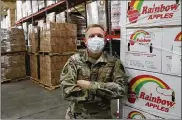  ?? BILL LACKEY / STAFF ?? Ohio AirNationa­lGuard Sgt. Bryon Ingramis about 100 days into his deployment at the SecondHarv­est Food Bank of Clark, Champaign and Logan Counties.