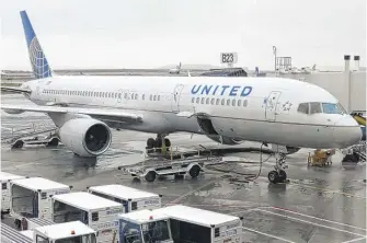  ?? DANIEL SLIM/AFP VIA GETTY IMAGES, FILE ?? Chicago-based United Airlines is still poised to furlough nearly 12,000 flight attendants, mechanics and other union employees starting later this week.