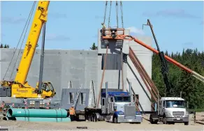  ?? CITIZEN FILE PHOTO ?? Constructi­on was underway at the new location of Inland Kenworth in the industrial park on Highway 97 south, across from Sintich Trailer Park, in May.