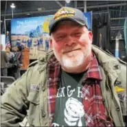  ?? CAROL QUAINTANCE - DIGITAL FIRST MEDIA ?? Veteran Tim Wallace spoke on behalf of Military Share, a mobile food distributi­on for needy veterans and their families, during a ceremony honoring veterans at the 2018 PA Farm Show on Jan. 11.