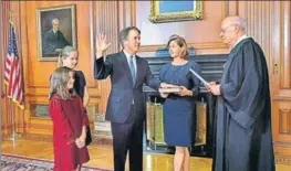  ?? AP ?? ■ Retired Justice Anthony M Kennedy (right) administer­s the Judicial Oath to Judge Brett Kavanaugh, who is accompanie­d by his family, in the Justices' Conference Room of the US Supreme Court.