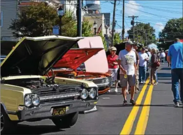  ?? MARIAN DENNIS — DIGITAL FIRST MEDIA ?? Main Street was filled with community members who came out to take a look at the cars on display during Royersford Community Day.