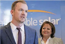  ??  ?? Affordable Solar President Kevin Bassalleck talks about the full-time positions his company will create as Gov. Susana Martinez listens during a news conference in Albuquerqu­e, N.M. Bassalleck, said tariffs would hurt homegrown companies that make...