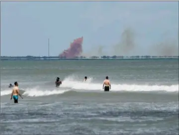  ??  ?? In this April 20 file photo, cloud of orange smoke rises Air Force Station, as seen from Cocoa Beach, Fla. CraIg BaIley/FlorIda Today VIa aP