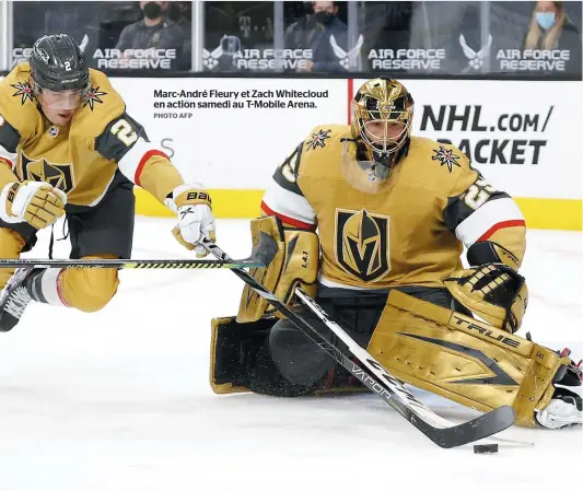  ?? PHOTO AFP ?? Marc-andré Fleury et Zach Whitecloud en action samedi au T-mobile Arena.