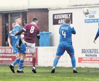  ?? ?? Heads we win Sean Heaver watches on as his header finds the net for Linlithgow’s opener