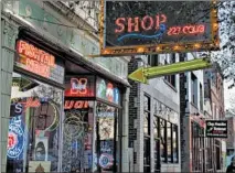  ?? BRIAN CASSELLA/CHICAGO TRIBUNE ?? Small businesses along Western Avenue in Bucktown are shown Dec. 3, including Neon Shop Fishtail.