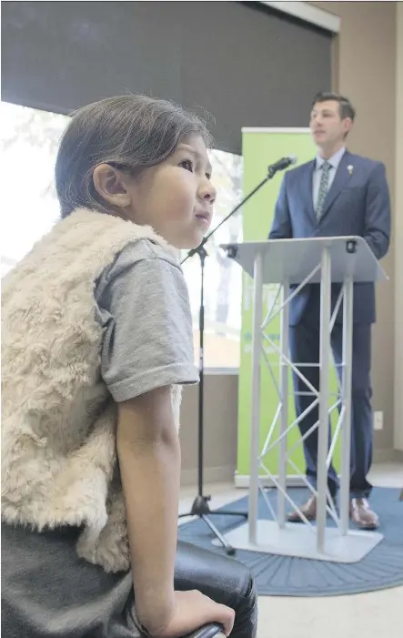  ?? SHAUGHN BUTTS ?? Don Iveson’s daughter Alice listens Tuesday as her dad makes his last policy announceme­nt of the mayoral election campaign. Monday is election day, but advance polls are open until Friday.