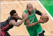 ?? MICHAEL DWYER/AP PHOTO ?? Boston Celtics center Al Horford goes up for a shot as Miami Heat guard Kyle Lowry defends during the second half in Game 5 of the Eastern Conference finals Thursday.