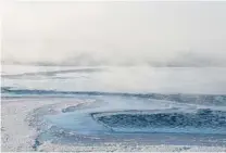  ??  ?? Mist rises from the Arctic Ocean near Barrow, Alaska.