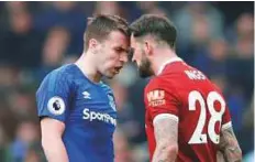  ?? Reuters ?? Everton’s Seamus Coleman clashes with Liverpool’s Danny Ings during the Premier League match.