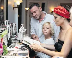  ?? PHOTOS: JACKIE MOLLOY/FOR THE WASHINGTON POST ?? Actor Liev Schreiber and his son Sasha talk to Posey during her book release party.