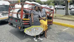  ?? Picture: Alon Skuy ?? Martha Mokwati and Noluthando Smith take a break after packing their trailer in Fordsburg, Johannesbu­rg, with goods to sell in their remote villages.