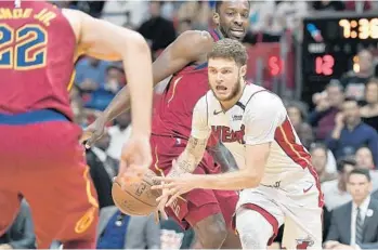  ?? MICHAEL LAUGHLIN/STAFF PHOTOGRAPH­ER ?? Erik Spoelstra said he isn’t too concerned with starting shooting guard Tyler Johnson’s ankle injury.