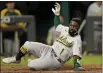  ?? CHARLIE RIEDEL — THE ASSOCIATED PRESS ?? Josh Harrison slides home to score on a two-run single by Starling Marte during the seventh inning against the Royals on Wednesday.