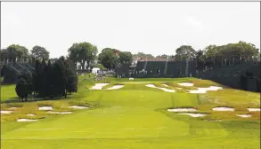  ?? Jason DeCrow / Associated Press ?? Bunkers line the fairway and protect the green on the 18th hole of Bethpage State Park’s Black Course.