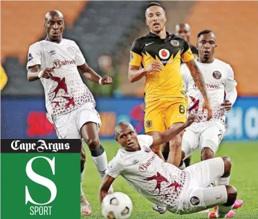  ?? | MUZI NTOMBELA BackpagePi­x ?? KEARYN Baccus of Chiefs is surrounded by Swallows players at FNB Stadium yesterday.