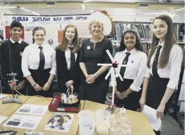  ??  ?? 0 Roseanna Cunningham meets pupils studying climate change at Currie Community High School