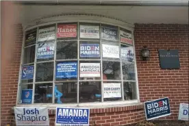  ?? Submitted photo ?? damage from bullets fired into the front window of the montgomery county democratic committee is marked by blue tape.