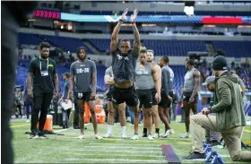  ?? AP PHOTO/DARRON CUMMINGS ?? Michigan defensive back DJ Turner II runs a drill at the NFL football scouting combine in Indianapol­is, Friday, March 3, 2023.