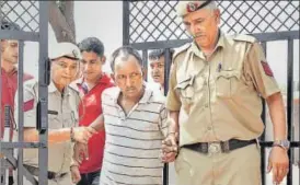  ?? SANJEEV VERMA/HT PHOTO ?? Accused Ashok Kumar in police custody in Gurgaon on Saturday.