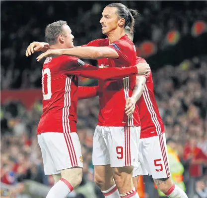  ??  ?? Manchester United’s Zlatan Ibrahimovi­c, right, celebrates scoring with Wayne Rooney.