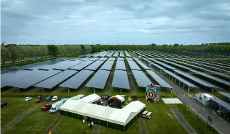  ?? ?? Cars are parked beneath the bifacial solar panels Lowlands Festival