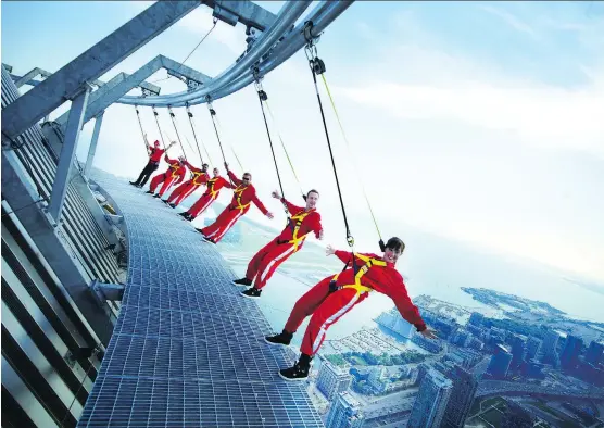  ?? TOURISM TORONTO ?? The Edge Walk at the CN Tower, 116 storeys above the ground, is highly popular Instagram spot for daredevils of all ages.