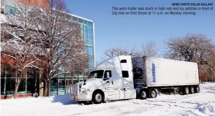  ?? NEWS PHOTO COLLIN GALLANT ?? This semi-trailer was stuck in high ruts and icy patches in front of City Hall on First Street at 11 a.m. on Monday morning.