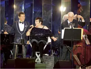  ??  ?? Left Liza Minnelli performs New York, New York
alongside Michael Feinstein. Below The star-spangled opulence of Alta Sartoria reflects the art-deco architectu­re of New York