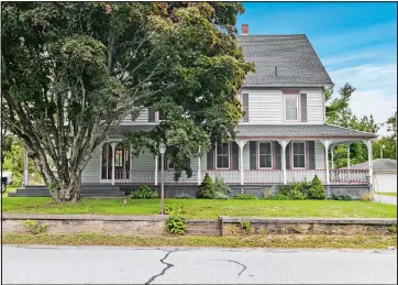  ?? Photo: Berkshire Hathaway HomeServic­es, New England Properties ?? Built in 1907, the five-bedroom farmhouse-style colonial at 52 Blissville Rd., Lisbon, has updated interiors, a separate in-law apartment and frontage on Blissville Pond.