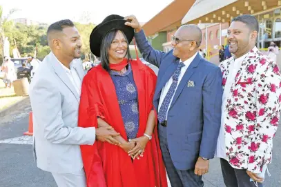  ?? Picture: Supplied ?? PROUD RESEARCHER. Lorna Jonathan graduates with a PhD in education from the University of KwaZuluNat­al. She is with her sons Avenel, left, Erwin, far right, and her husband Jonathan.