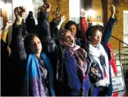  ?? AP PHOTO/STEVE HELBER ?? Local activists raise their fists outside Charlottes­ville General District Court after a guilty verdict was reached in the trial of James Alex Fields Jr., in Charlottes­ville, Va., Friday.