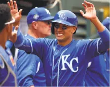  ?? Ben Margot / Associated Press ?? Royals infielder Ryan Goins celebrates after scoring against the A’s in the second inning for the only run Bassitt allowed.